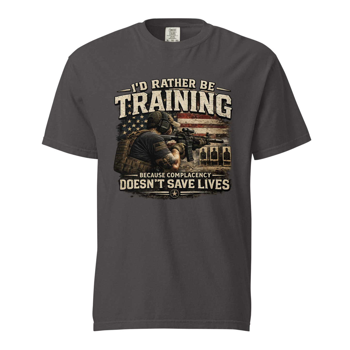 I'd Rather Be Training graphic shirt featuring a shooter on the range with the message Because Complacency Doesn't Save Lives for firearms training and shooting sports enthusiasts.