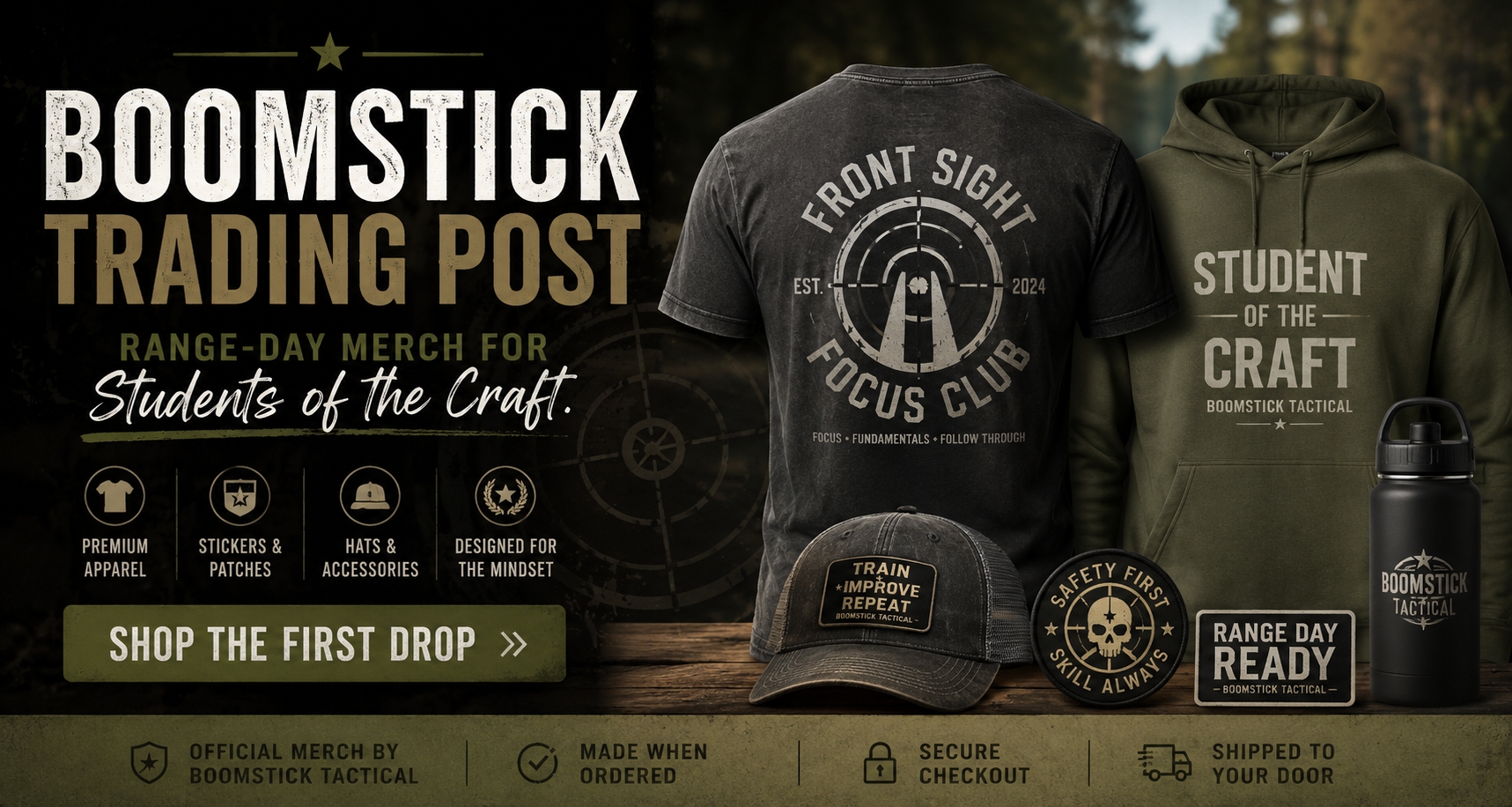 Boomstick Trading Post merchandise including t-shirt, hoodie, and water bottle on a wooden surface.